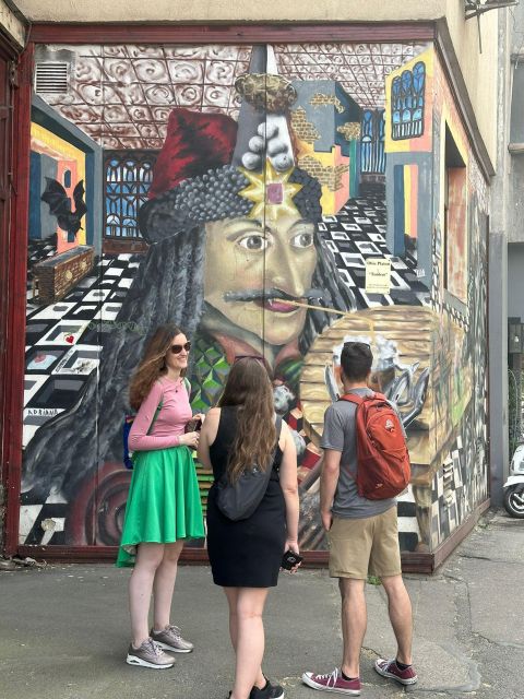 Bucharest Alternative Walking Tour - Cinema Capitol Garden and the restored Square Cat mural