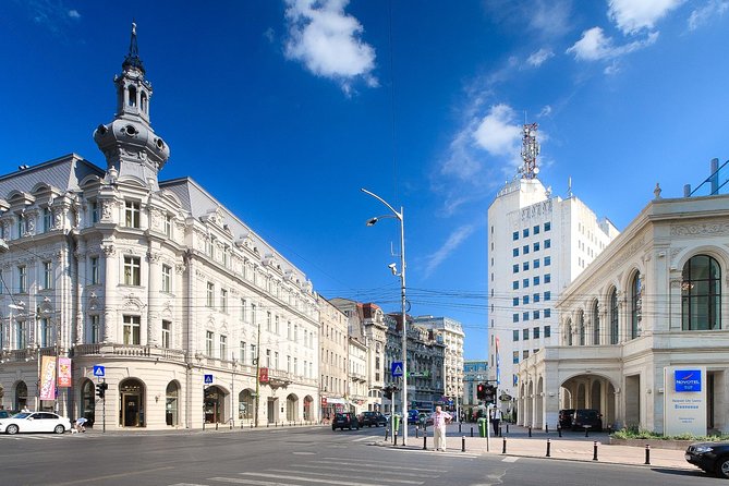 Bucharest Highlights Bike Tour - The Palace of Parliament and Piata Revolutiei: the ride hits its dramatic peak