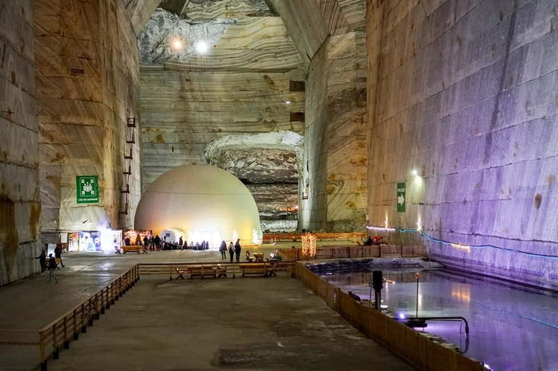 Bucharest: Muddy Volcanoes and Salt Mine Private Day Tour - Unirea Salt Mine in Slănic: huge caverns, natural ventilation, and a 12°C reality check