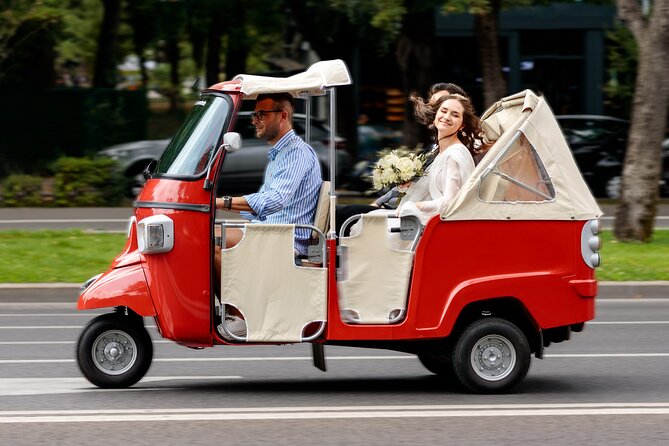 Bucharest Tuk Tuk city tour - Stop 1: University Square, the National Theatre, and the Grand Hotel Continental