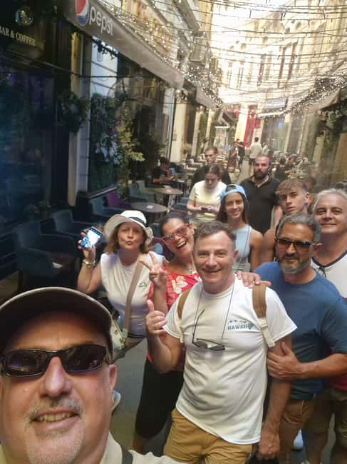 Bucharest: Walking tour with Italian speaking guide for small groups - Starting at Caru cu Bere, then walking into the Lipscani mood