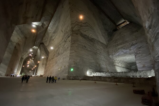 Salt Mine Tour from Bucharest with Entrance Ticket - Entering the Mine: Salt Lake, Waterfall, and the 217-Meter Chill